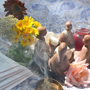 rooted in the rhythms of the life force, crystalline consciousness of Earth and cosmos. Relationships woven by a trusting heart in community with land and sky.  Illumination of gratitude.
sunny photo of sacred ceremony.