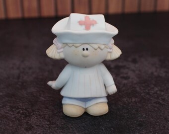 Vintage bisque porcelain Bumpkins nurse figurine designed by Fabrizio for George Good