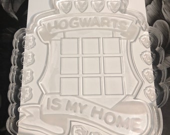 May include: Clear plastic Hogwarts themed tray with a shield design and the text "Hogwarts is my home".