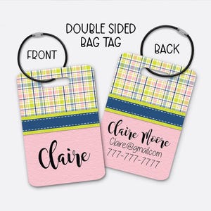 May include: Double-sided bag tag with a pink textured background. The front side has the name "Claire" in black script. The back side has the name "Claire Moore", email, and phone number. The top has a plaid pattern.