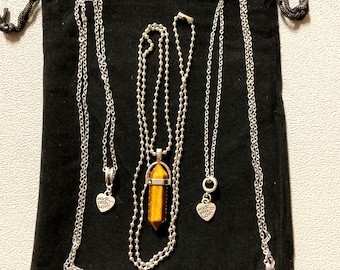 Three pendant necklaces bundled with a fabric gift bag