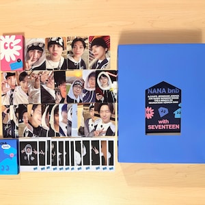 May include: A collection of Seventeen merchandise, including photo cards, a small blue box, and a large blue box with the text "NANA bnb with SEVENTEEN". The photo cards feature images of the band members.
