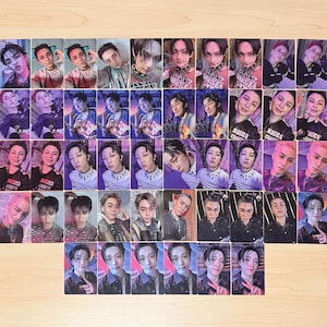 May include: A collection of rectangular photo cards featuring various individuals in diverse poses and outfits. The cards showcase a range of colours, including pink, purple, and black. Some cards have text that reads "MAGICA CRAFTY".