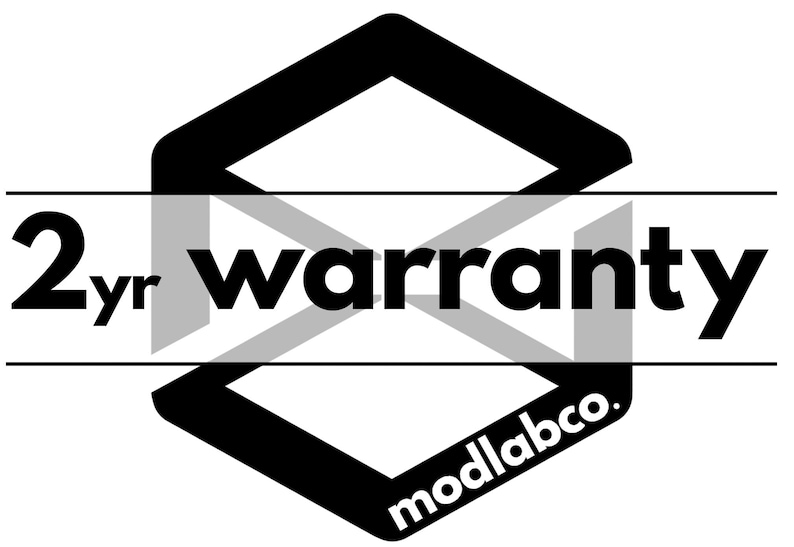 May include: Black and white graphic with the text "2yr warranty" over a geometric shape. The brand name "modlabco." is at the bottom of the shape. The design is simple and modern.