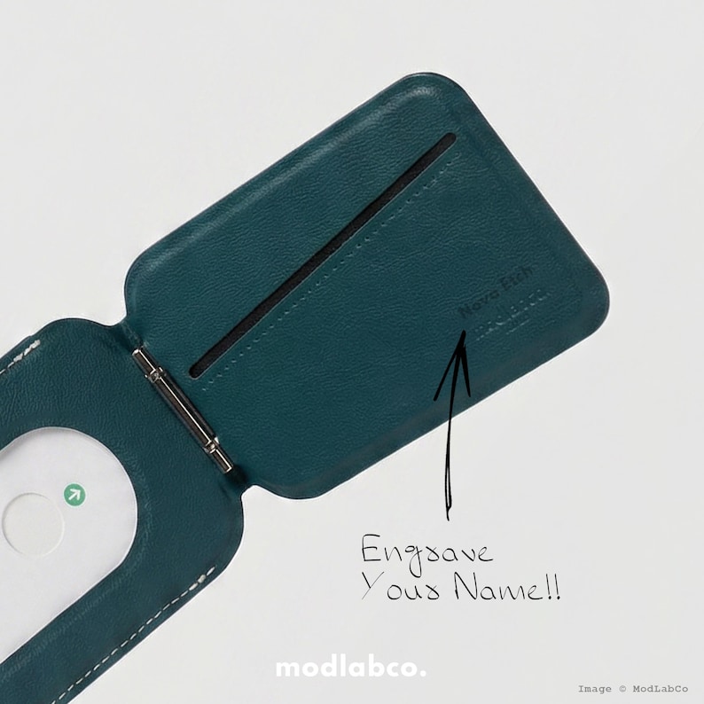 May include: Teal leather wallet with a magnetic money clip. The wallet is open, revealing a card slot and the text "Engrave Your Name!!". The brand name "Modlabco" is at the bottom.