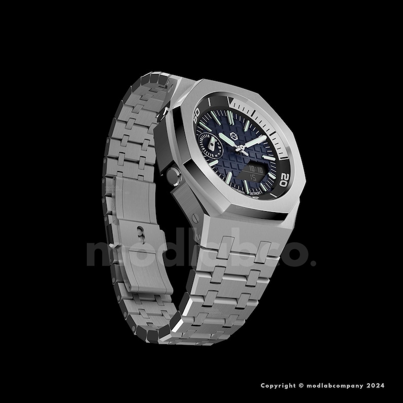 May include: A silver-toned wristwatch with a dark blue face and a matching silver band. The watch has a geometric design with a textured face and a date display. The watch is set against a black background.
