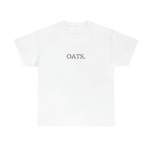 May include: White t-shirt with the word "OATS." printed in black on the front.