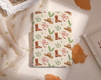 May include: A beige and white patterned phone case with a repeating design of cowboy boots, snakes, and hats.