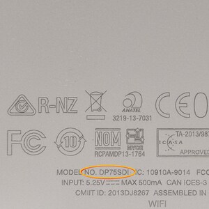 May include: Close-up of a white device with various certifications and regulatory markings, including FCC, IC, CMIIT, NOM, and CE. The model number is DP75SDI. The device has an input of 5.25V and a maximum output of 500mA. It is assembled in China and supports WiFi.