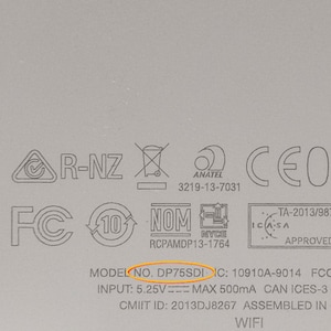 May include: Close-up of a white device with various certifications and regulatory markings, including FCC, IC, CMIIT, NOM, and CE. The model number is DP75SDI. The text "INPUT: 5.25V MAX 500mA" is also visible.
