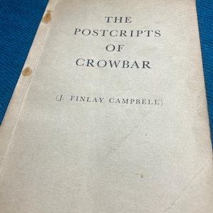May include: A vintage book titled "The Postcripts of Crowbar" by J. Finlay Campbell. The book has a cream-colored cover with black text. The cover shows signs of age with some stains and wear. The book is set against a blue background.