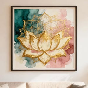 May include: A framed wall art print featuring a gold lotus flower design with a geometric pattern overlay. The artwork has a watercolor background in teal, pink, and cream colors. The print is displayed above a beige sofa in a living room setting.