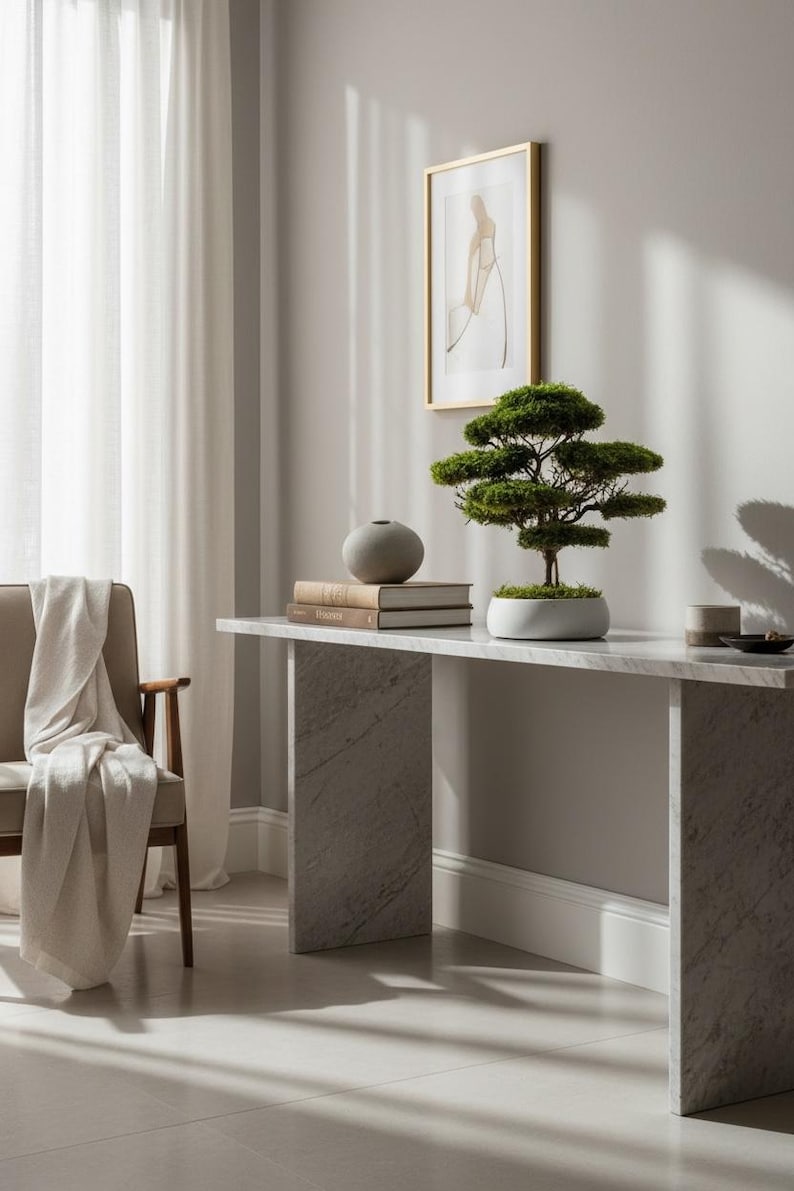 Natural-looking preserved flat moss bonsai, mounted on real roots and displayed in a handcrafted white concrete pot with a moss-covered base.