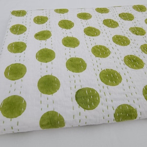 May include: White cotton quilt with a green polka dot pattern. The dots are hand-stitched and create a unique and textured look.
