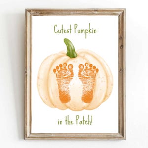 May include: A white pumpkin with two orange baby footprints on it. The text "Cutest Pumpkin in the Patch!" is written below the pumpkin.