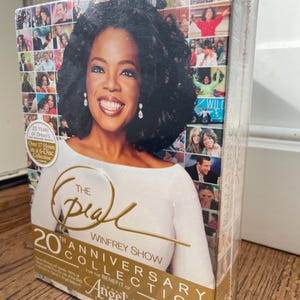 May include: The Oprah Winfrey Show 20th Anniversary Collection DVD set. The box features a photo of Oprah Winfrey and includes the text "20 Years of Oprah's" and "Over 17 Hours in a 6-Disc Collection."
