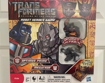 May include: A Transformers: Revenge of the Fallen board game featuring Optimus Prime and Megatron. The game is for 2 players, ages 5 and up. The box includes two small plastic figures of Optimus Prime and Megatron.
