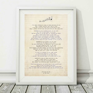 May include: A vintage-style print of the lyrics to the song "Pictures of You" by The Cure. The lyrics are printed on a light beige background with a typewriter font.