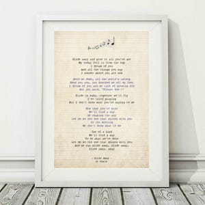 May include: A vintage-style printable featuring the lyrics to the song "Slide Away" by Oasis. The lyrics are printed on a light brown background with a white grid pattern. The text is in a typewriter font and is printed in black and purple.