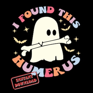 May include: A colorful graphic design featuring a ghost holding a bone with the text "I found this humerus" in a rainbow color scheme. The design is surrounded by bats and stars.