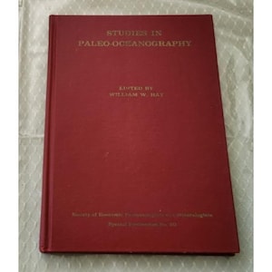 May include: A maroon hardcover book titled "STUDIES IN PALEO-OCEANOGRAPHY" edited by William W. Hay. The book is a special publication of the Society of Economic Paleontologists and Mineralogists.