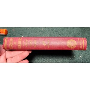 May include: A red hardcover book titled "Essentials of Pediatrics" by Jeans and Blake, 4th Edition, published by Lippincott.