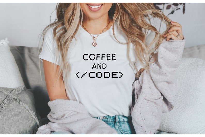 May include: A white t-shirt with the text "COFFEE AND </CODE>" printed on the front.