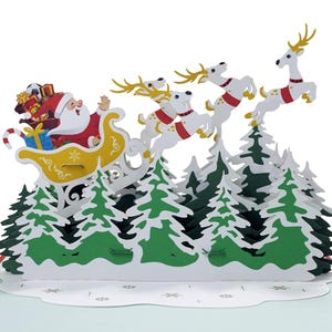 Carte pop-up 3D avec traîneau et renne du père Noël. Une délicieuse carte de voeux surprise pour les enfants, les amis et la famille. 15 cm x 20 cm