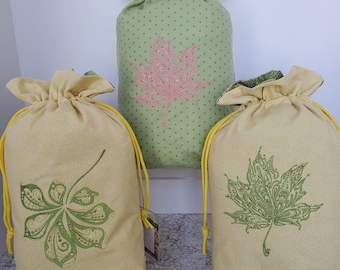 Bolsa de regalo con cordón ajustable de tela con hojas bordadas