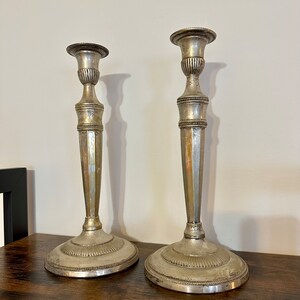 Pair of silvered brass candlesticks
