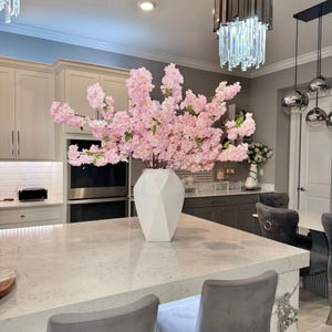 3.5 foot silk flowers

Aria cherry blossom branches

realistic silk cherry blossoms

pink blossom branches for vase

tall artificial flower stems

cherry blossoms for floor vase

table centerpiece cherry blossoms

wedding cherry blossom decor

home