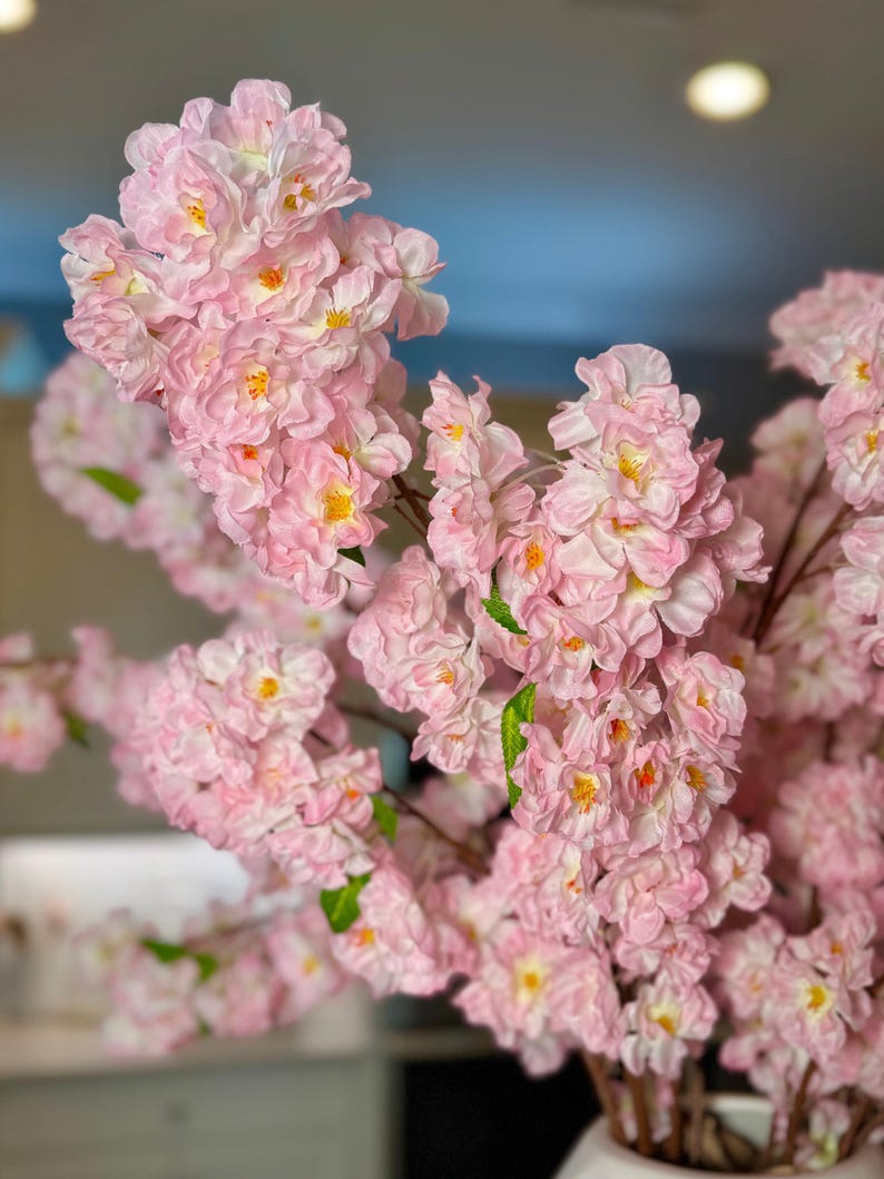 office decor artificial branches

spring home decor branches

baby shower pink decorations

event decor cherry blossoms

vase filler branches

lush floral arrangement

decorative branches for living room

bedroom decor pink flowers

everlasting