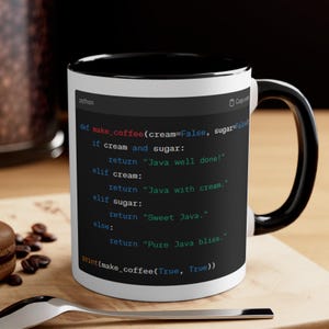 May include: A white coffee mug with a black handle and a black rim. The mug features a black and white image of Python code with the text "def make_coffee(cream=False, sugar=False".