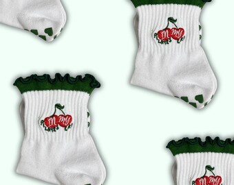 May include: White ankle socks with green trim and a red cherry embroidery that says "In my  feels".
