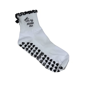 In my Pilates era black and white bow grip sock with heart grips for Pilates, Barre, Yoga or Lagree