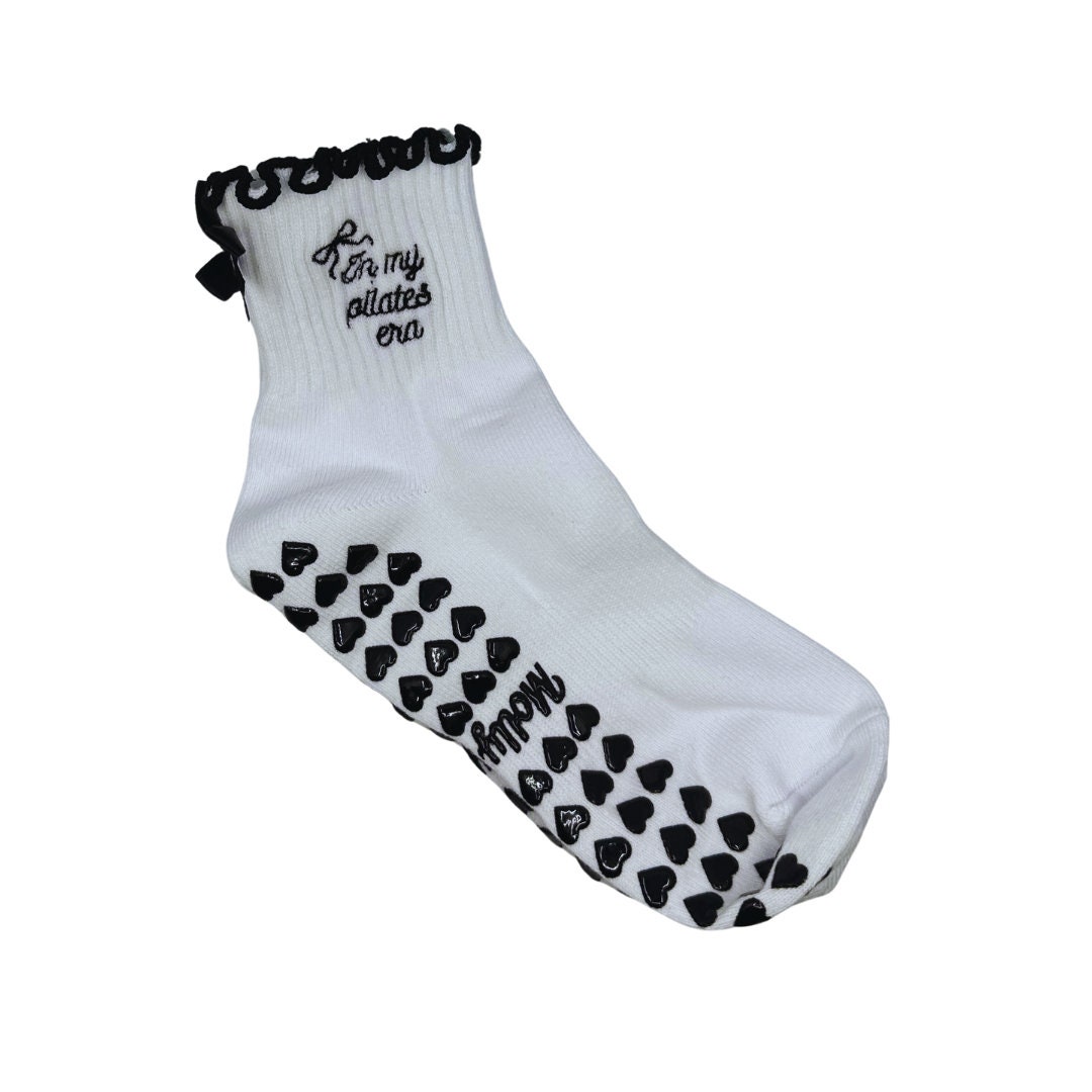 In my Pilates era black and white bow grip sock with heart grips for Pilates, Barre, Yoga or Lagree