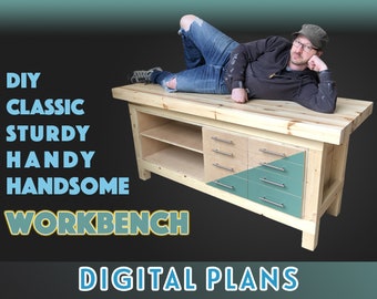 May include: DIY Classic Sturdy Handy Handsome Workbench Digital Plans. A wooden workbench with a light wood top, a shelf, and drawers with teal and natural wood fronts. A person is lying on top of the workbench.