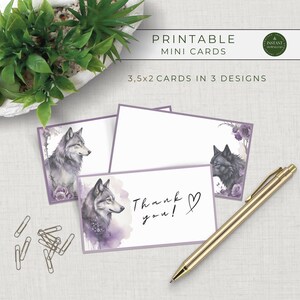 May include: Printable mini cards featuring watercolor wolf illustrations in three designs. The cards are 3.5 x 2 inches and include a "Thank you!" card. A gold pen and paper clips are also in the image.