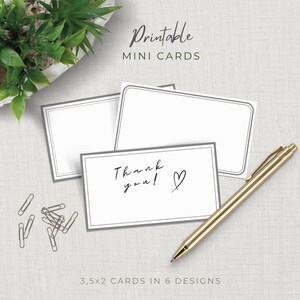 May include: White mini cards with gray borders, one with "Thank you!" and a heart. A gold pen and paper clips are next to the cards. The text "Printable Mini Cards" and "3.5x2 Cards in 6 Designs" are also visible.