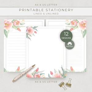 May include: Printable stationery set with floral designs. The set includes lined and unlined paper, with a watercolor floral border in pink and green. The text on the image reads "PRINTABLE STATIONERY" and "12 DESIGNS". Includes a pen and paper clips.