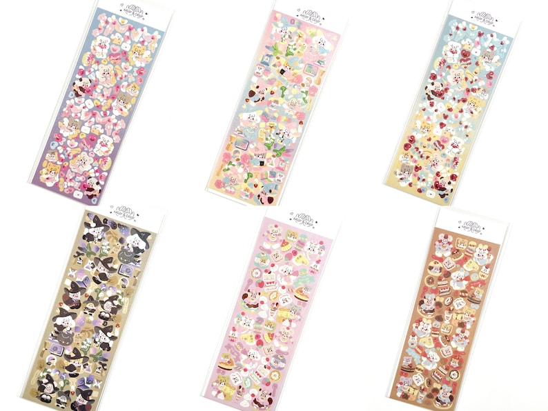 May include: Six sticker sheets with various designs. Each sheet is rectangular and filled with colorful, cartoon-style illustrations. The stickers feature themes like animals, food, and other cute elements. The sheets are packaged in clear plastic.