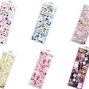 May include: Six sticker sheets with various designs. Each sheet is rectangular and packaged in clear plastic. The designs include cartoon animals, flowers, and fruits in pastel colors. The top of each sheet has a white header with text.