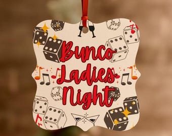 May include: A square-shaped ornament with rounded edges, featuring a cream background with a pattern of black dice, red musical notes, and martini glasses. The text Bunco Ladies Night is printed in large, bold red script in the centre.
