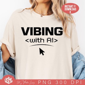 May include: A cream-colored t-shirt with the words "VIBING <with AI>" in bold black letters. Below the text is a curved line and a black cursor icon. The shirt has rolled-up sleeves.