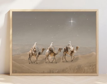 May include: A framed print depicts three figures riding camels across a desert landscape under a starry sky. The figures are draped in white robes, and a bright star shines above them. The artwork is in muted earth tones.