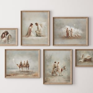 May include: A set of framed art prints depicting religious scenes. The artwork shows figures in muted tones, including a couple, angels, shepherds with sheep, and the three wise men on camels. The frames are a light wood colour.