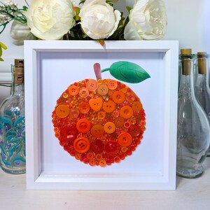 Orange button art mosaic: framed fruit picture for nursery or kitchen