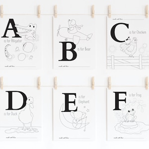May include: Black and white printable alphabet flash cards featuring an animal for each letter. The cards include an alligator, bear, chicken, duck, elephant, and frog.