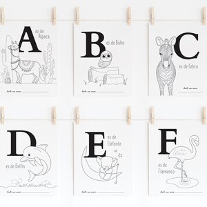 May include: Black and white printable alphabet flash cards featuring an animal for each letter. The cards include the letter, the animal, and the Spanish word for the animal. The animals include an alpaca, owl, zebra, dolphin, elephant, and flamingo.