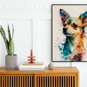 May include: A watercolor painting of a chihuahua dog with colorful splashes of paint in the background. The dog is looking to the left of the frame and has a light brown coat.
